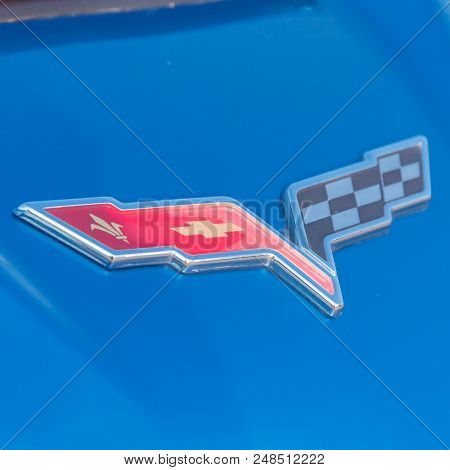 Corvette Brand Logo On Blue Convertible Manufactured By Chevrolet