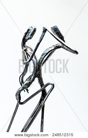 Figures Of Performers Made With Welded Black Metal Wire. Dancers Are Dancing Stylish With Sexy Passi