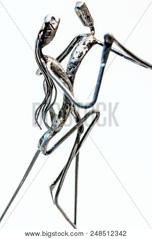 Figures Of Performers Made With Welded Black Metal Wire. Dancers Are Dancing Stylish With Sexy Passi