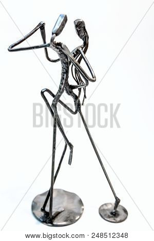 Figures Of Performers Made With Welded Black Metal Wire. Dancers Are Dancing Stylish With Sexy Passi