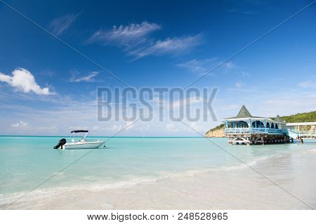 Enjoy Benefits Being Beside Sea. Sea Turquoise Water Bungalow And Ship Near Beach. Vacation Sea Sand