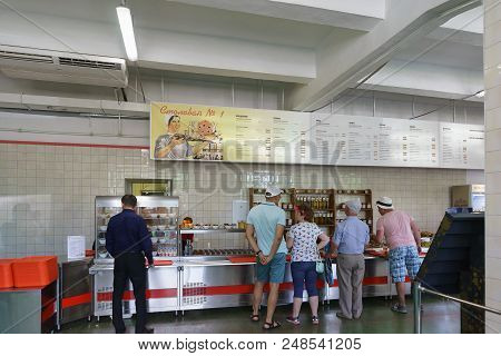 Vacationers Choose Dishes In A Stylized Soviet Dining Room. Inscription In Russian Dining Room №1 An