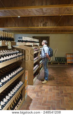 Tourist In The Company Store Grotto Factory Sparkling Wines Abrau-durso Looks At The Windows With Bo