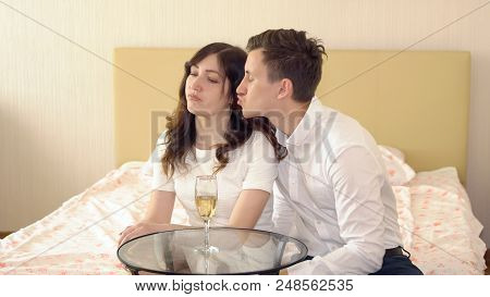 Young Man Pestering A Woman In The Bedroom