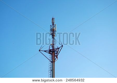 High-voltage Wires On Poles Under High Voltage. Tinted Image. Power Plants On The Industry.