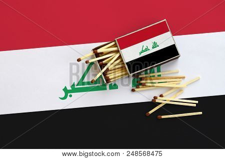 Iraq Flag  Is Shown On An Open Matchbox, From Which Several Matches Fall And Lies On A Large Flag.