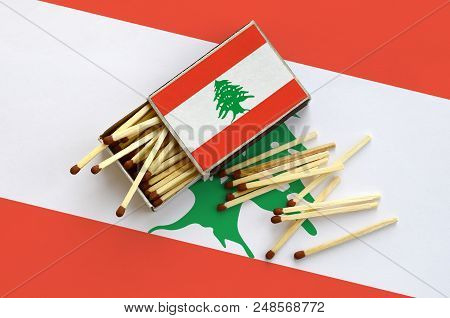 Lebanon Flag  Is Shown On An Open Matchbox, From Which Several Matches Fall And Lies On A Large Flag