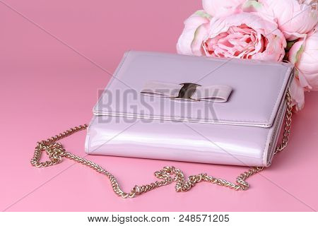 Female Lady Clatch Bag On Pink Background