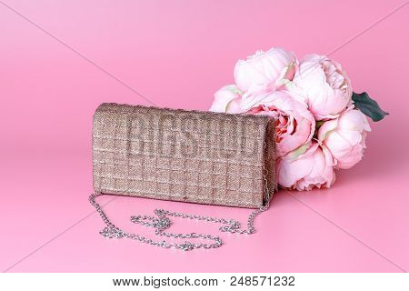Female Lady Clatch Bag On Pink Background