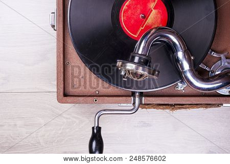 Old Gramophone Player, Closeup. Retro Styled Image Of A Collection Of Old Vinyl Record Lp's With Sle
