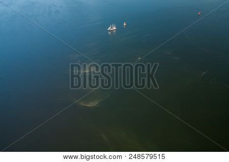 Two Lonely Sailboats In The Middle Of The Sea. Aerial View From Above.