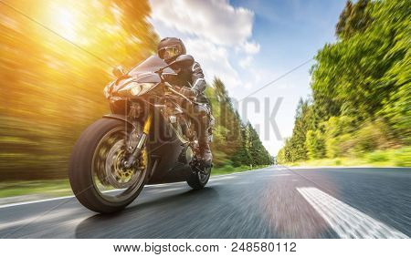 Motorbike On The Road Riding. Having Fun Riding The Empty Road On A Motorcycle Tour / Journey