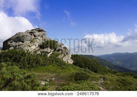 Photo Of Mountain Landscape In The Summer Under Beautiful Cloudy Sky. Ukraine, Carpathians, Dzembron