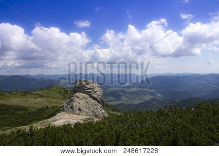 Photo Of Mountain Landscape In The Summer Under Beautiful Cloudy Sky. Ukraine, Carpathians, Dzembron