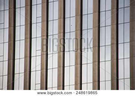 Detail Of Modern Architecture Glass Windows With Concrete Columns Of A Corporate Building