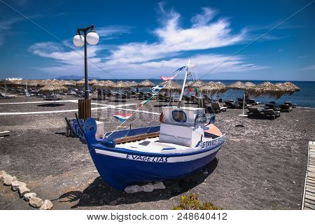 Santorini, Greece- Jun 11, 2016. Permissa black sand beach in Santorini on Jun 11, 2016. Greece. 