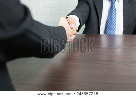Businessman Shaking Hands After Successful Dealing For Investment With Parthner