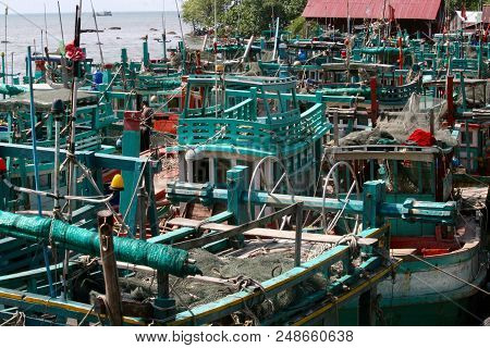 All The Fishing Boats Tied Up Together In A Fishing Village