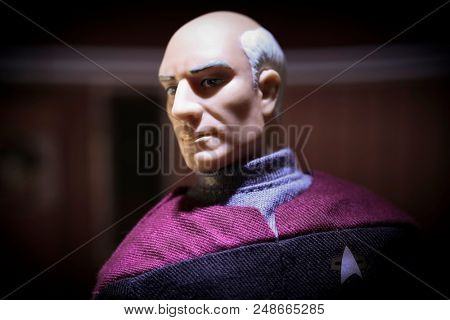 JULY 3 2018: Scene from Star Trek The Next Generation with Captain Jean-Luc Picard in his ready room aboard the USS Enterprise with dramatic overhead lighting - Playmates 9 inch action figure