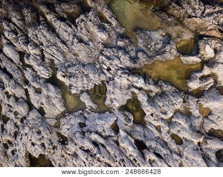 Aerial over coastal rock pools
