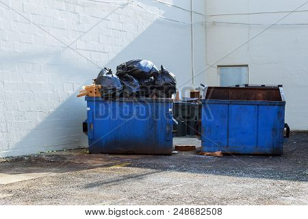 Full Construction Rubbish Bin With Loads At Construction Site Waste Debris Container, Garbage
