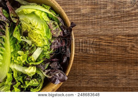 Fresh Green Lettuce Red Little Gem Variety Chopped In A Wooden Bowl Flatlay On Brown Wood