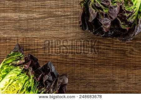 Group Of Two Whole Fresh Green Lettuce Red Little Gem Variety Flatlay On Brown Wood