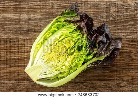 One Half Of Fresh Green Lettuce Red Little Gem Variety Flatlay On Brown Wood