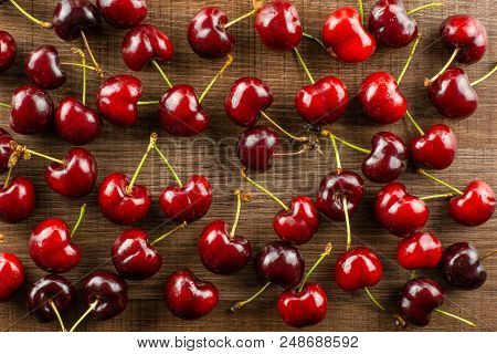 Sweet Bright Red Cherry Flatlay On Brown Wood