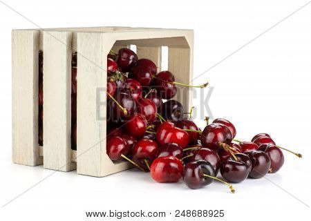 Sweet Bright Red Cherry Out Of A Wooden Box Isolated On White