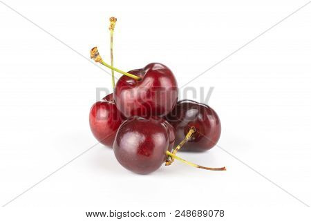 Group Of Four Whole Sweet Bright Red Cherry Heap Isolated On White