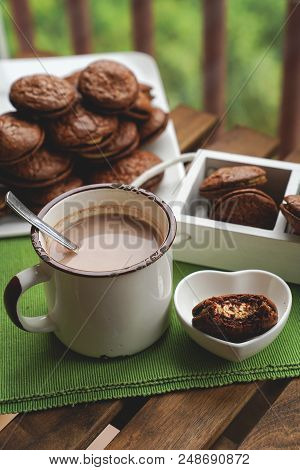 Fudge Brownie Cookies With Penut And Cheese Filling On White Plate On Wooden Background With Cacao O