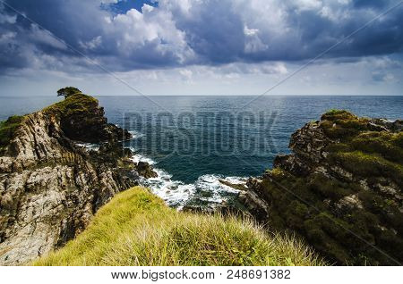Hidden Beauty Of Kapas Island Located In Malaysia With Unique Rocks Formation And Blue Sky.