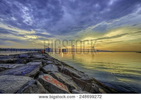 Jetty By Bride With Blue Yellow Orange Sun Set