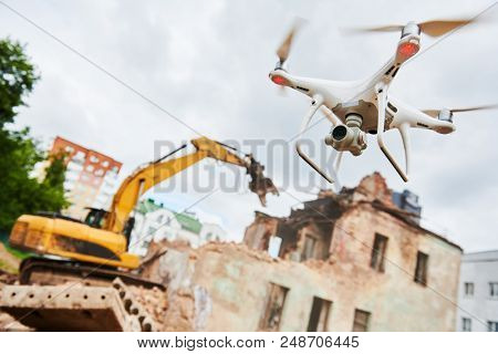 Drone operated by construction worker on building site
