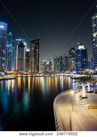 Dubai, United Arab Emirates - June 6, 2018: Dubai Marina Modern And Shiny Skyscrapers Reflected In T
