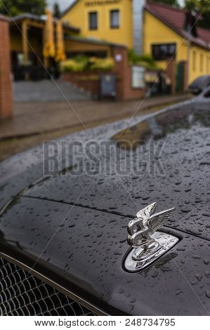 Berlin - August 2014: Bentley Logo On The Hood Of Mulsanne, Covered With Raindrops. Mulsanne - Launc