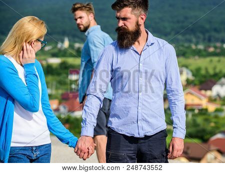 Husband Strictly Watching His Wife Looking At Another Guy While Walk. Jealous Concept. Man With Bear