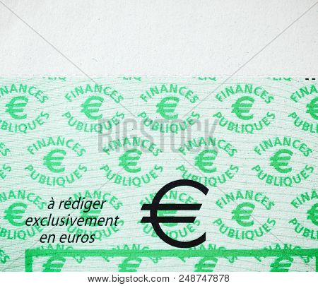 Paris, France - Jan 1, 2015: Euro Sign On Cheque Issued By The Direction Generale Des Finances Publi