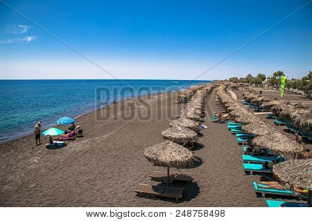 Permissa black sand beach in Santorini. Greece. 