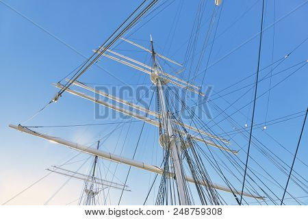 Ship masts in glowing highlights