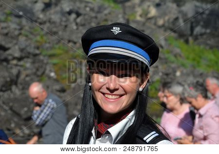 Female Train Conductor on The famous Flam Railway station. June 17,2018. Flam, Norway, Scandinavia.