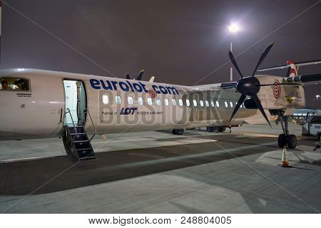 WARSAW, POLAND - CIRCA NOVEMBER, 2017:  Eurolot Bombardier Q400 NextGen at Warsaw Chopin Airport.