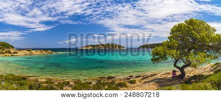 Beautiful Panorama With The Mediterranean Sea In Greece. Crystal And Colorful Water, Rocks, Vegetati