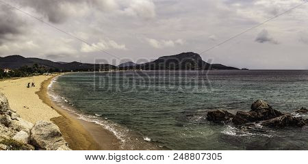 Beautiful Panorama With The Mediterranean Sea In Greece. Crystal And Colorful Water, Rocks, Vegetati