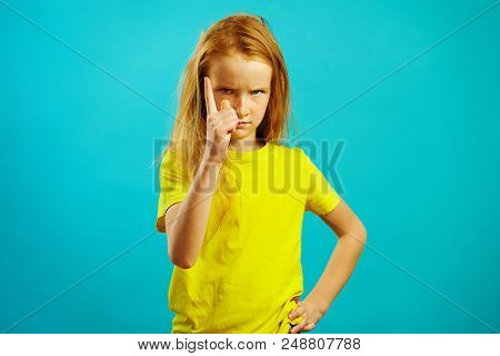 Strict Child Girl Ten Years Threatens To Finger At The Camera, Has An Angry Look, Demonstrates Capti