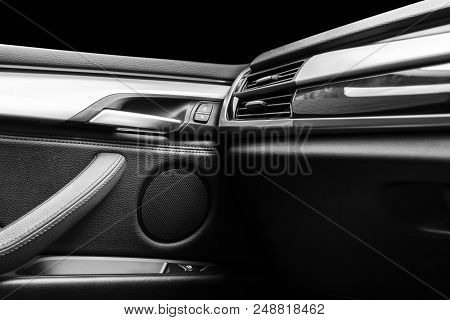 Door Handle With Power Window Control Buttons Of A Luxury Passenger Car. Black Leather Interior Of T