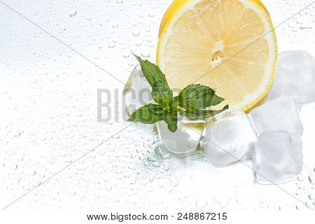 Lemon Ring With Ice And Mint On A Silvery Background Closeup
