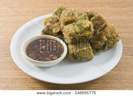 Plate Of Fried Chinese Pancake Or Fried Steamed Dumpling Made Of Garlic Chives, Rice Flour And Tapio