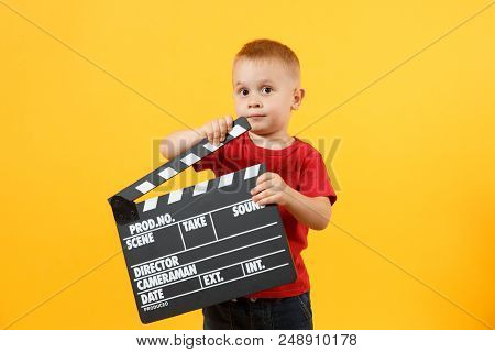 Little Cute Kid Baby Boy 3-4 Years Old In Red T-shirt Holding In Hand Classik Black Film Making Clap